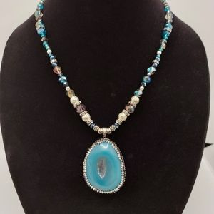 Glass and metal beads with stone pendant